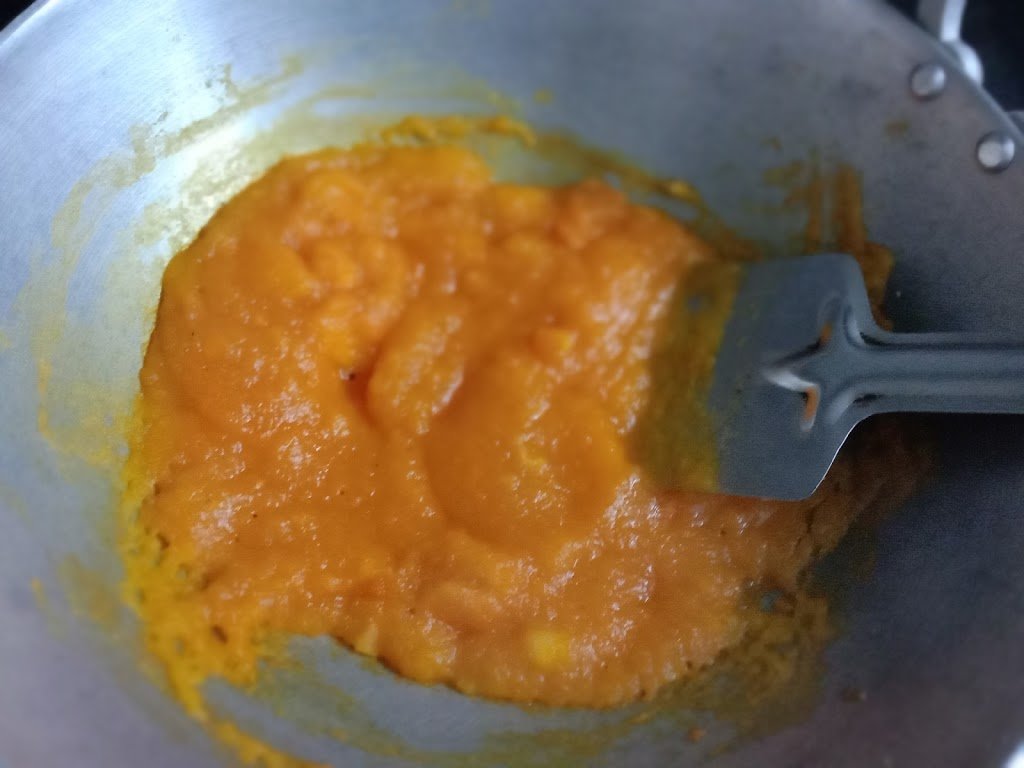 Heating Papaya pulp in kadhai, Papaya halwa recipe.