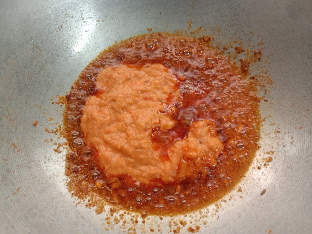 Adding spices to the paste, Rajma curry recipe.