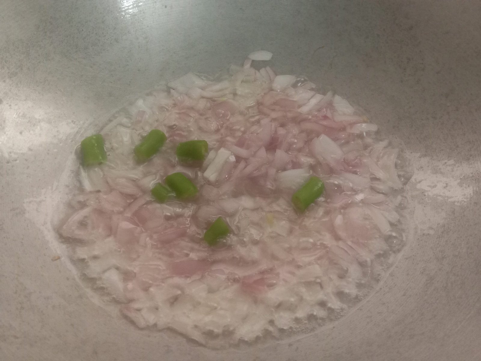 Frying onions in pot, Egg bhurji maggi noodles recipe.