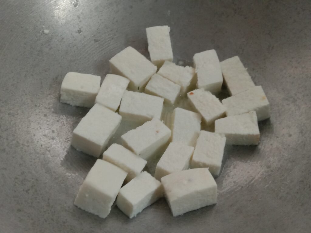 Frying paneer cubes in kadhai, Butter paneer recipe.