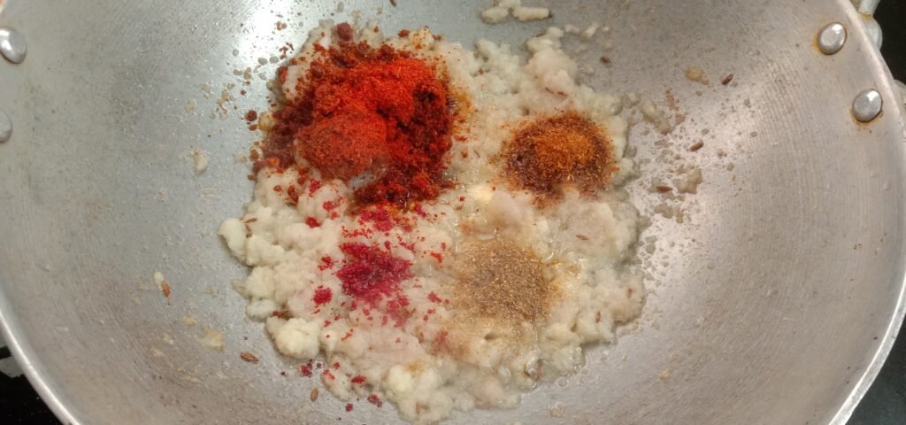 Adding ingredients in to kadhai, Pav bhaji recipe.