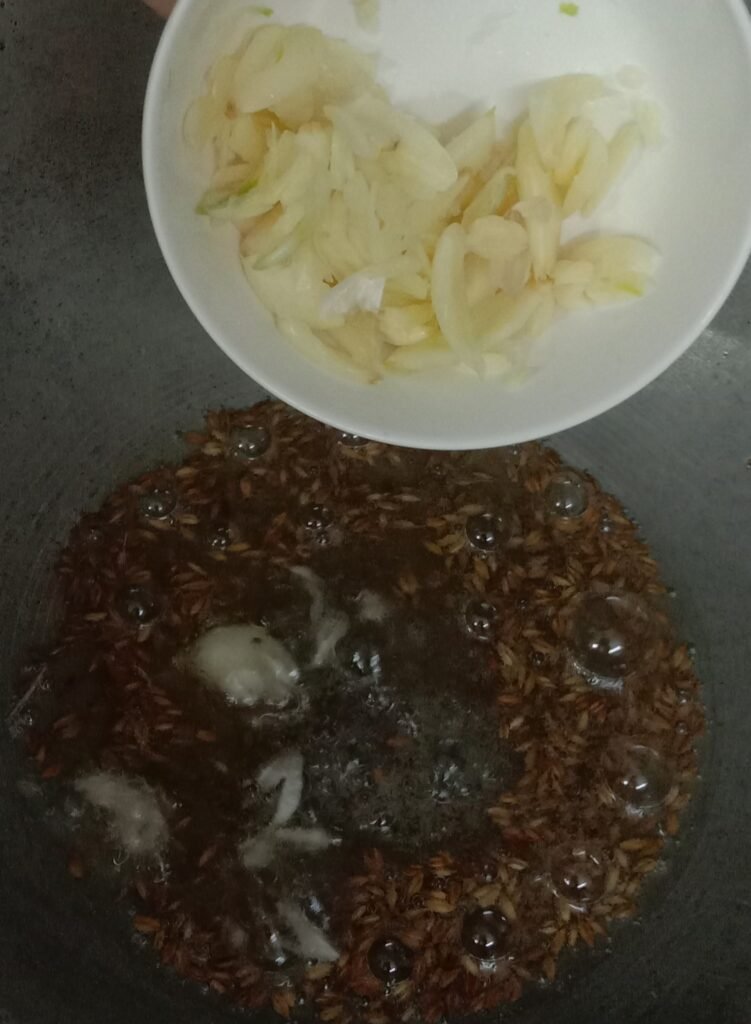 Frying Jeera, Mustered seeds and garlic, Chivda recipe.