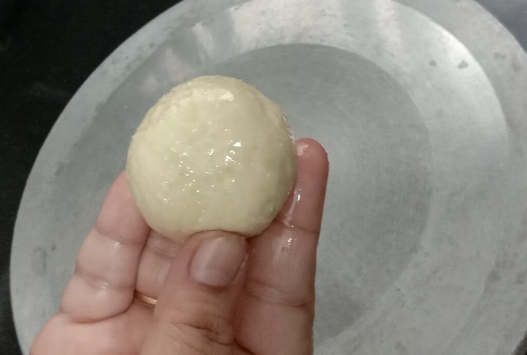 Preparing dough balls, Chole bhature recipe.