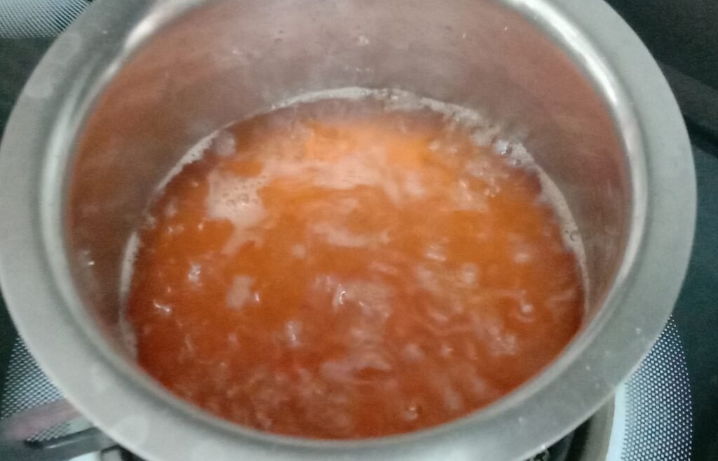 Jaggery syrup in pot, Sweet potato recipe.