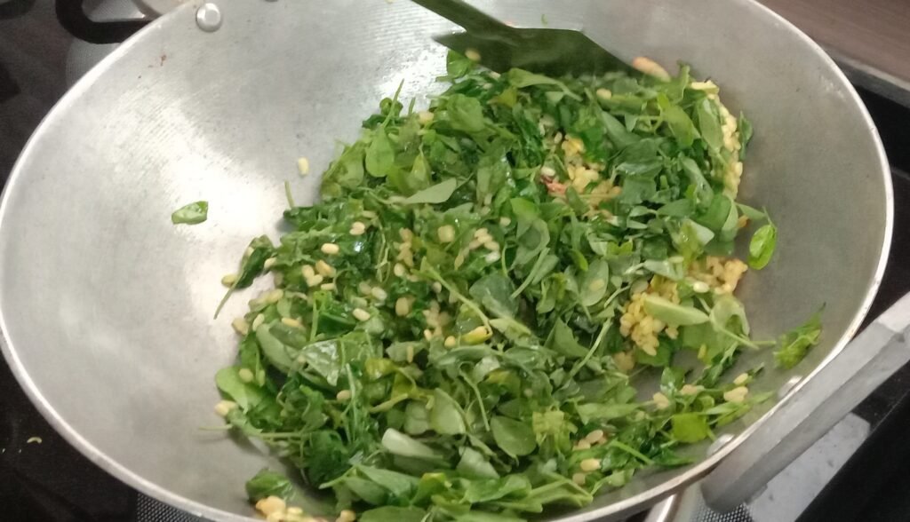 Mixing methi leaves and dal, Methi bhaji recipe.