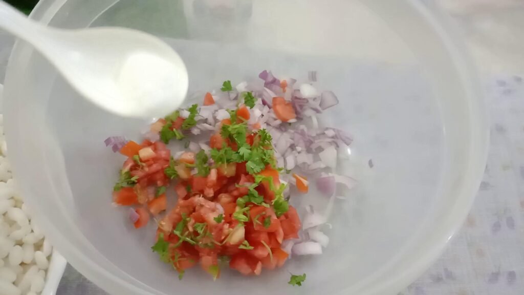 Adding salt in pot, Bhel recipe.