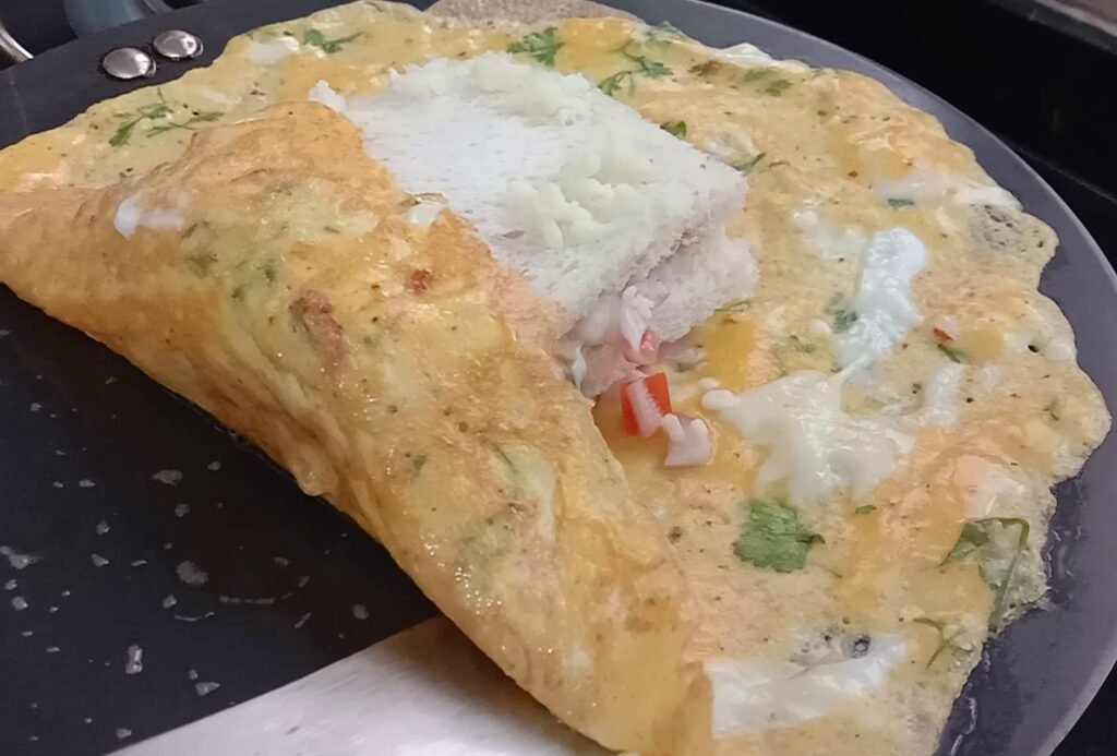 Adding cheese to omelette, Egg sandwich recipe.
