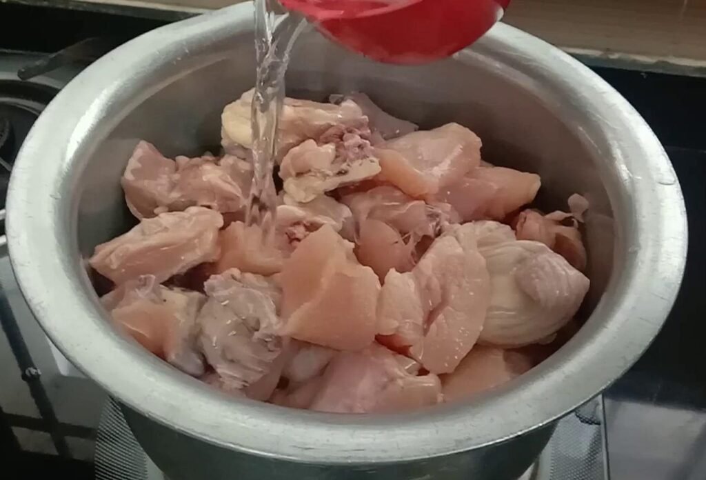 Adding water to chicken, Chicken biryani.
