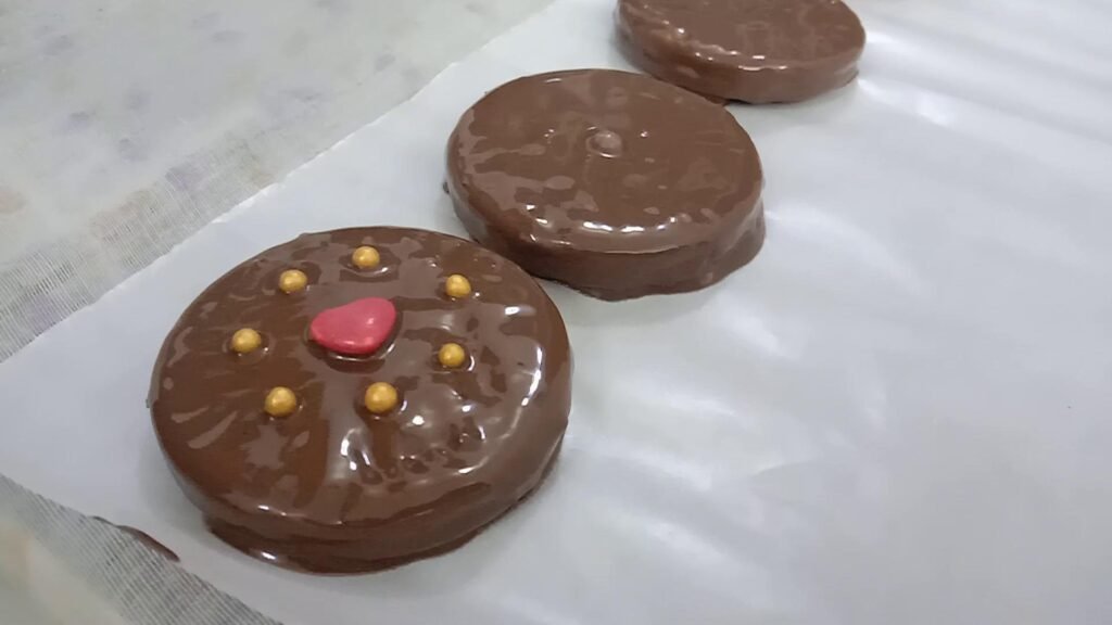 Decorating cookies with Golden edible balls, Chocolate dipped cookies.