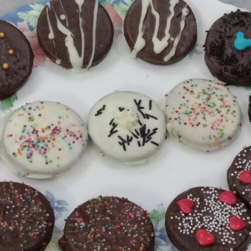 Decorated cookies in plate, Chocolate dipped cookies.