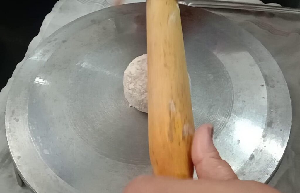Rolling dough ball, Aloo paratha recipe.