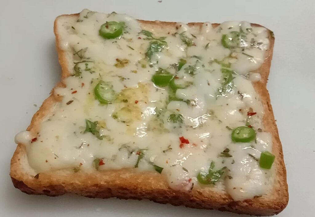 Backed bread with cheese mix, Chilli cheese toast.