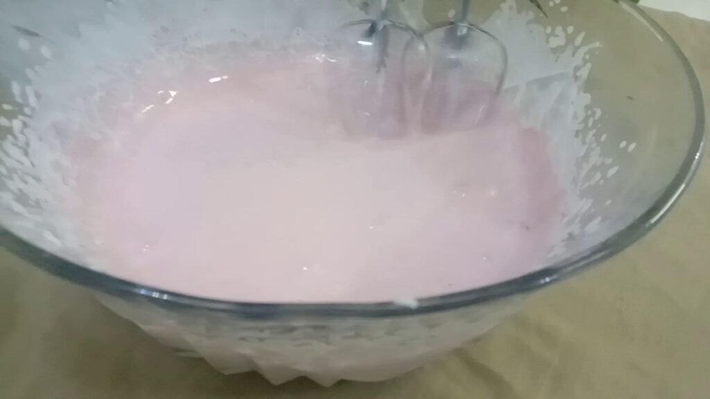 Adding strawberry puree to cream, Strawberry mousse recipe. 