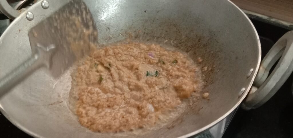 Adding masala paste in kadhai, Bhindi masala recipe.