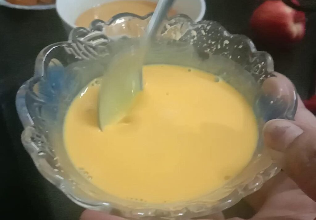Mixing custard powder with milk, Rusk pudding shahi tukda recipe.
