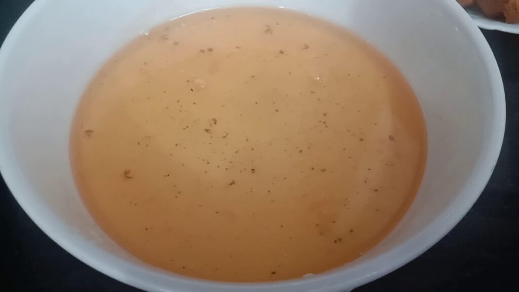 Sugar syrup in bowl, Rusk pudding shahi tukda recipe. 