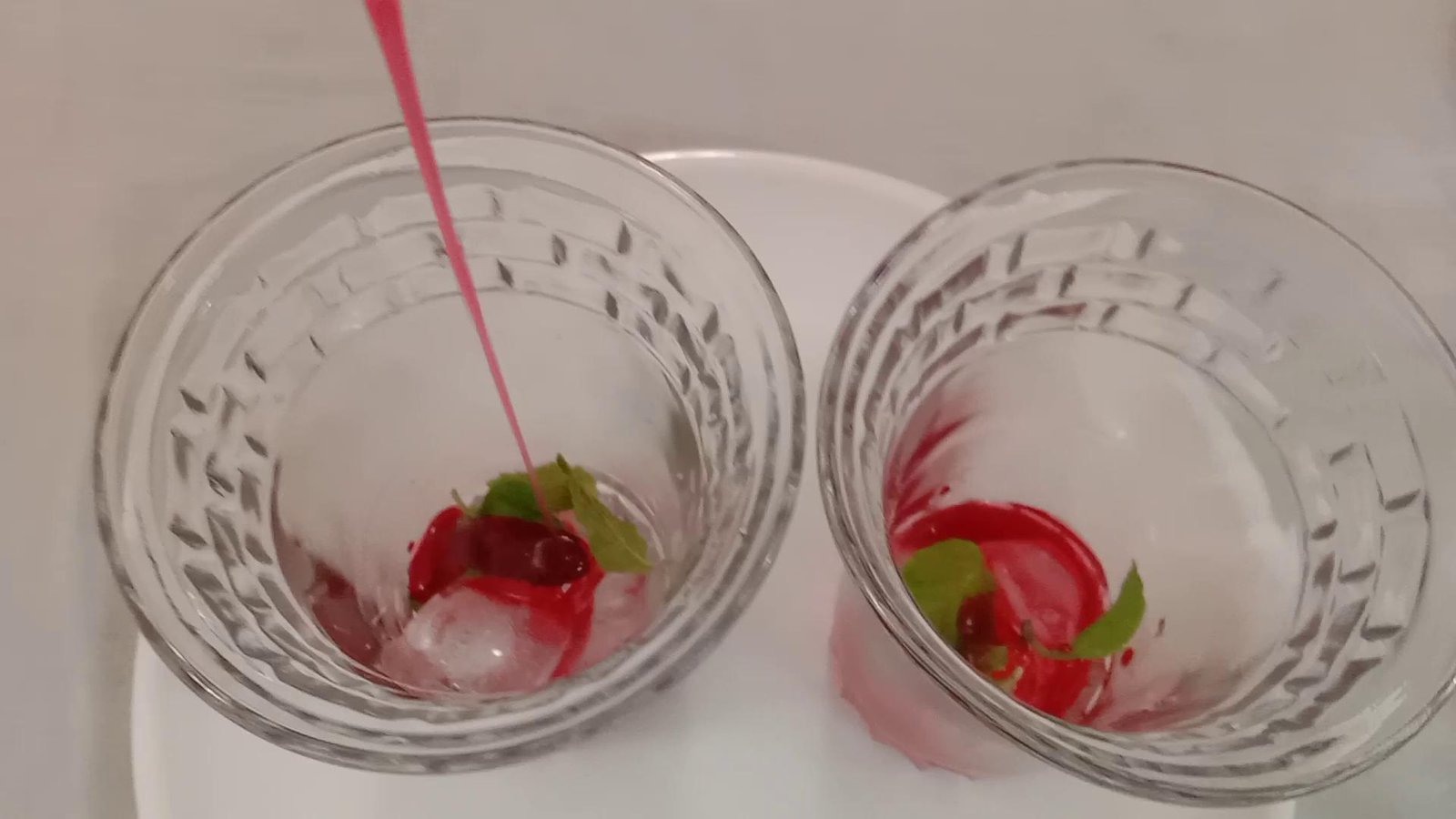 Adding ice cubes, mint leaves and roohafza syrup, Watermelon juice.