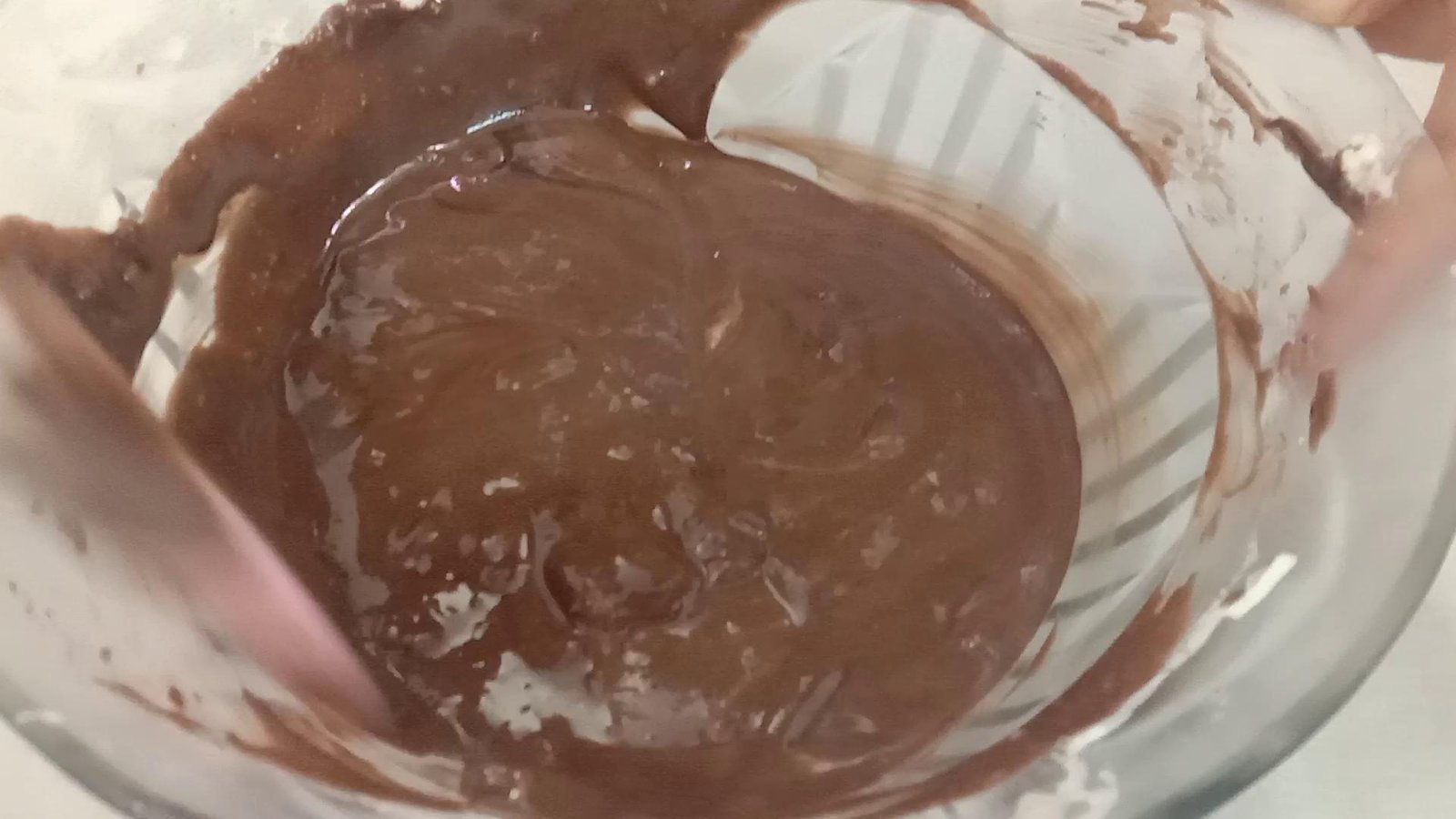 Mixing cream and chocolate, Chocolate mousse recipe. 