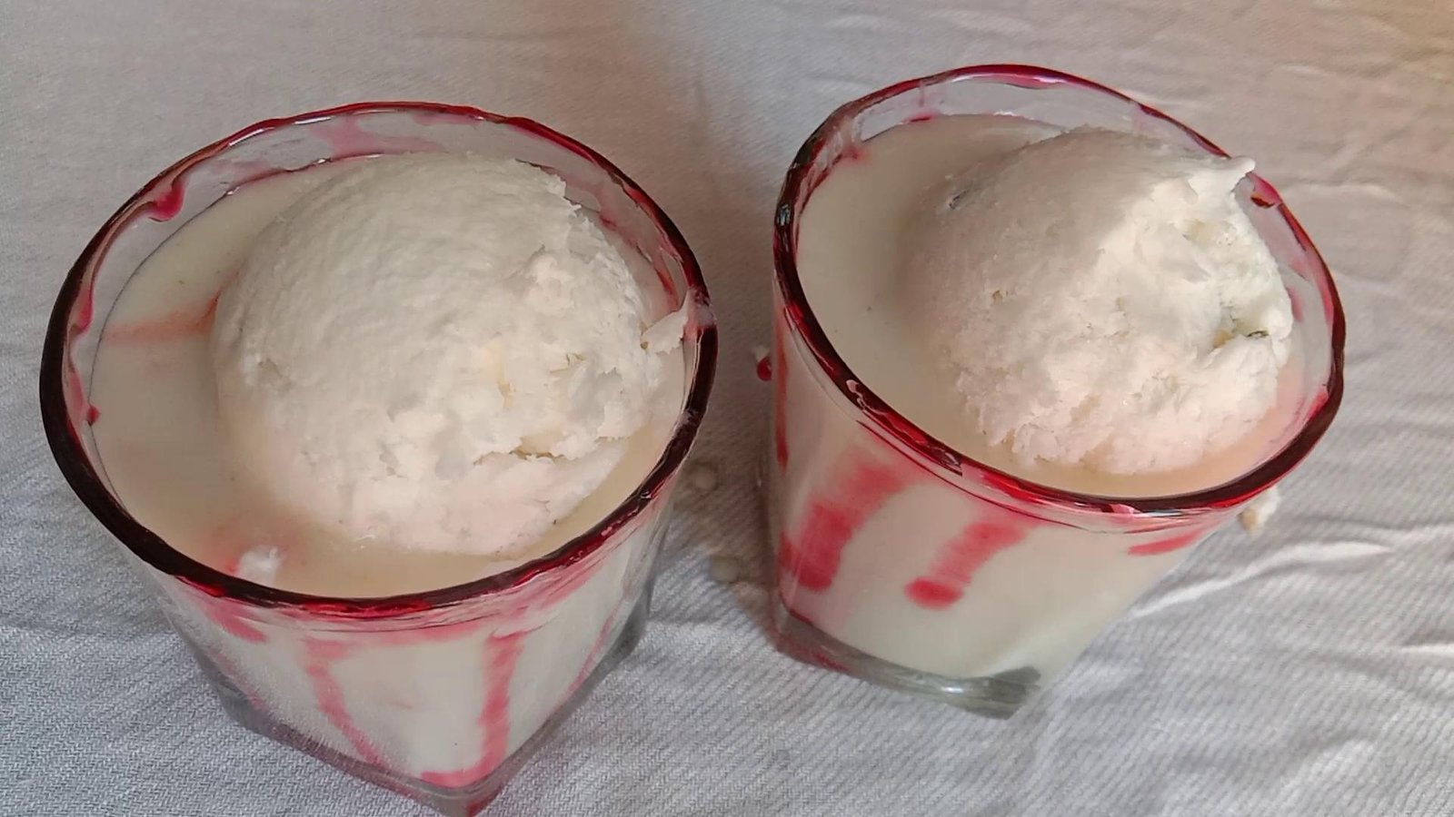 Vanilla ice cream on top of smoothie, Guava Smoothie.