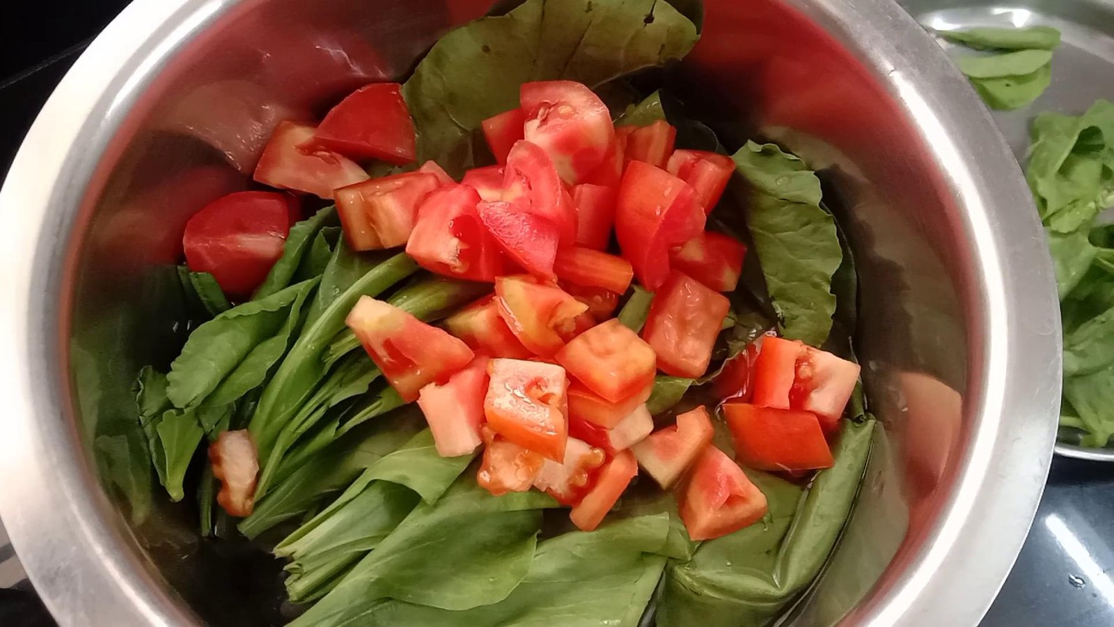Adding chopped tomatoes to pot, Palak paneer-Spinach Paneer